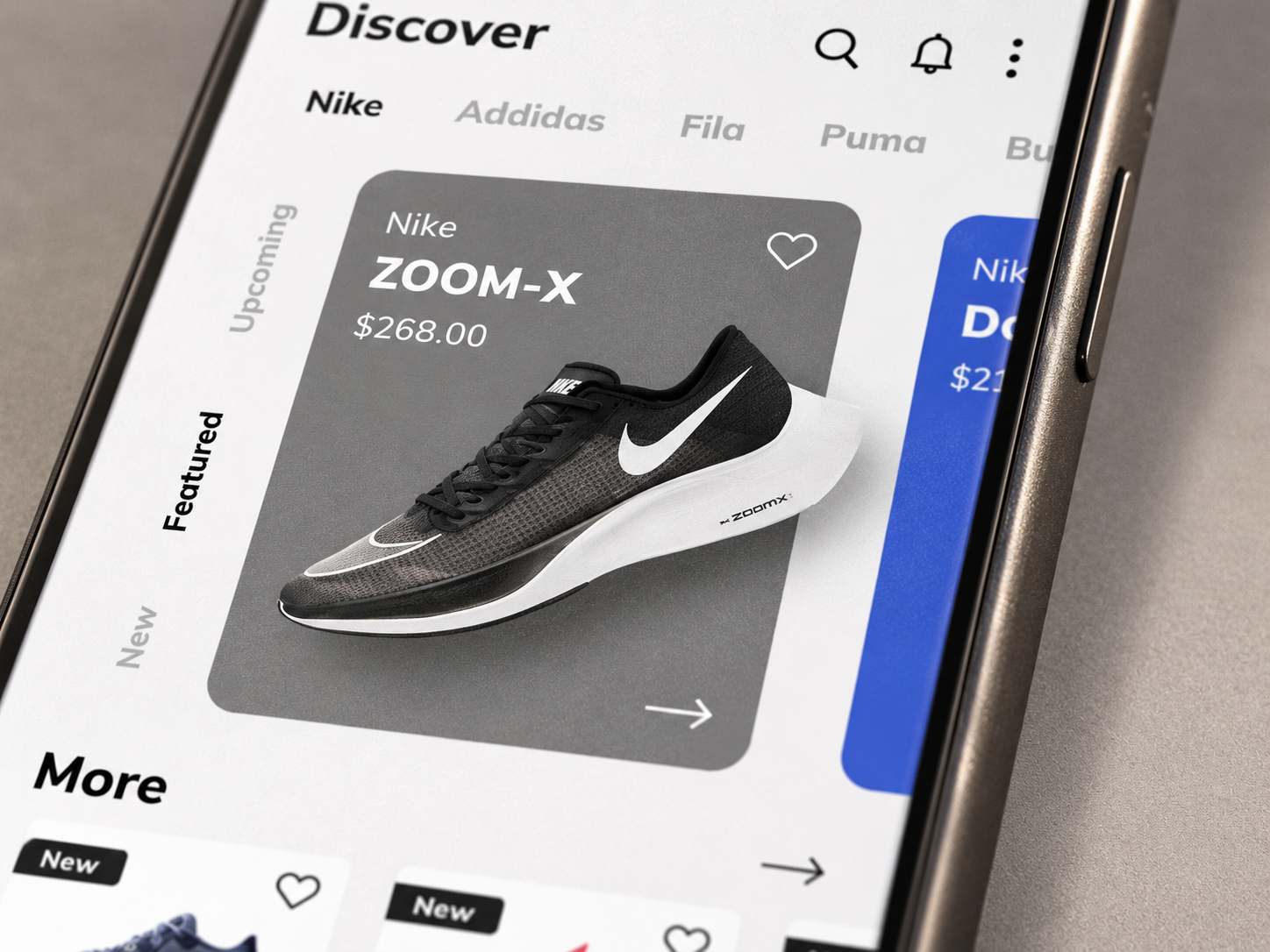 Close-up of the sneaker app's Discover screen featuring the Nike ZOOM-X product card.